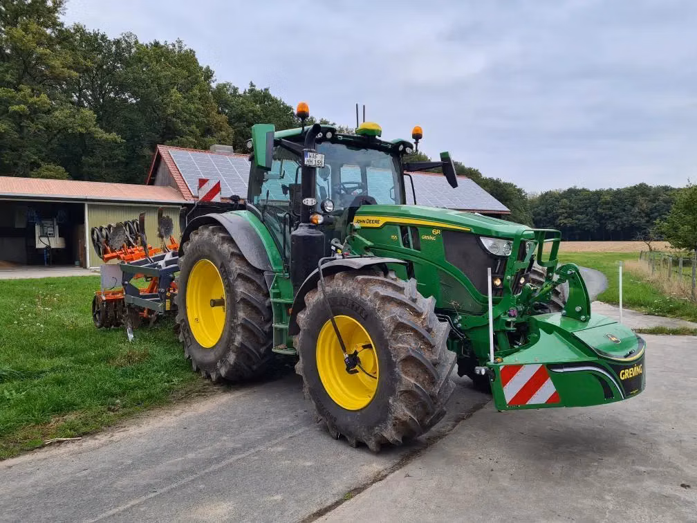 John Deere tractor with a TractorBumper front weight