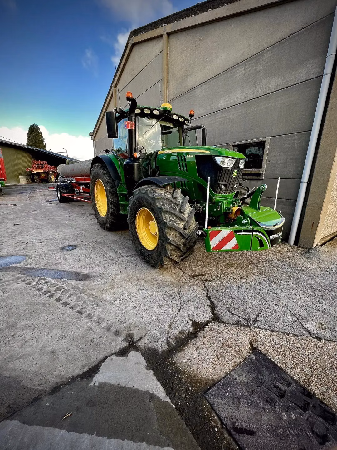 John Deere tractor with a TractorBumper front bumper and front weight