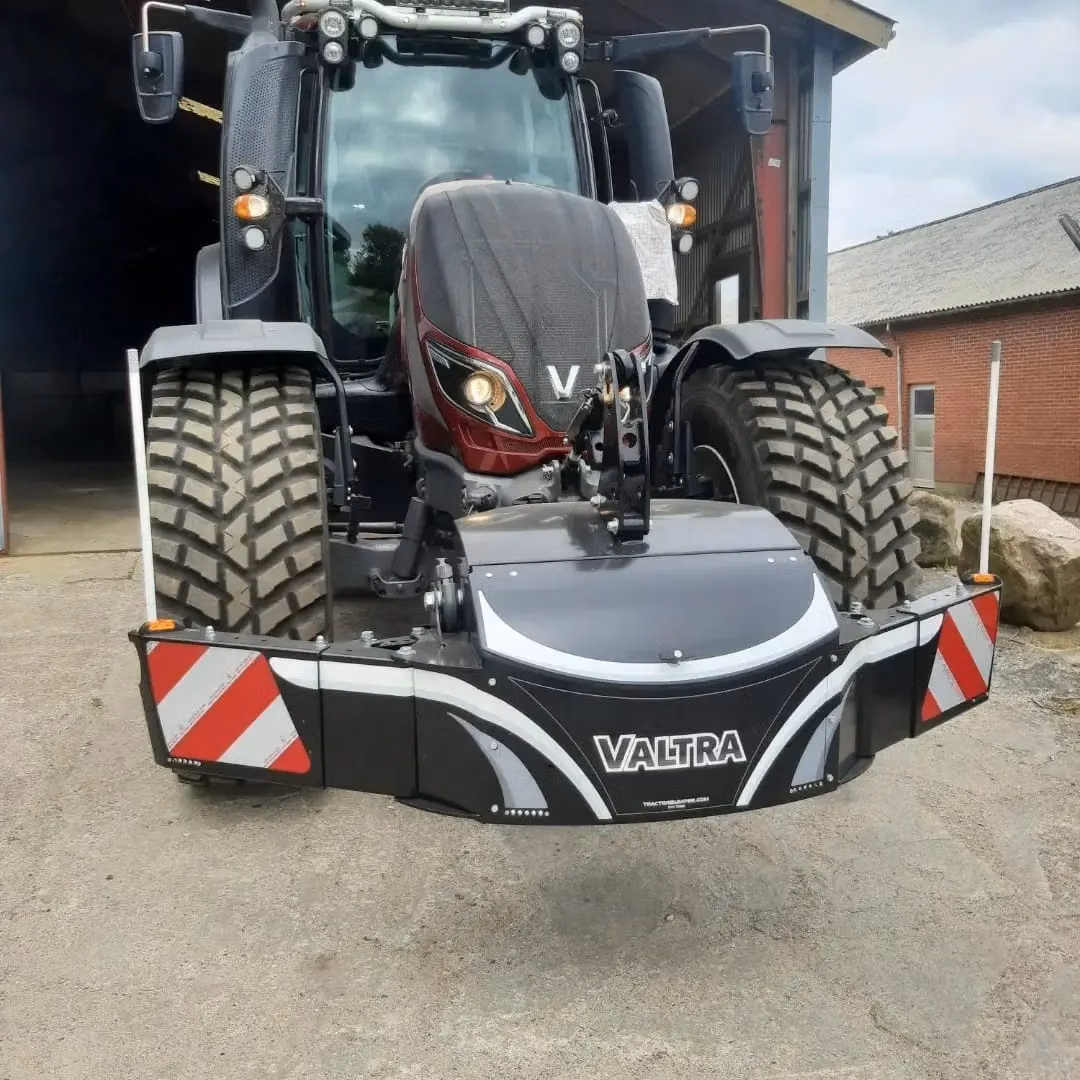 Valtra tractor with a front weight bumper featuring reflectors, storage compartments and LED lights