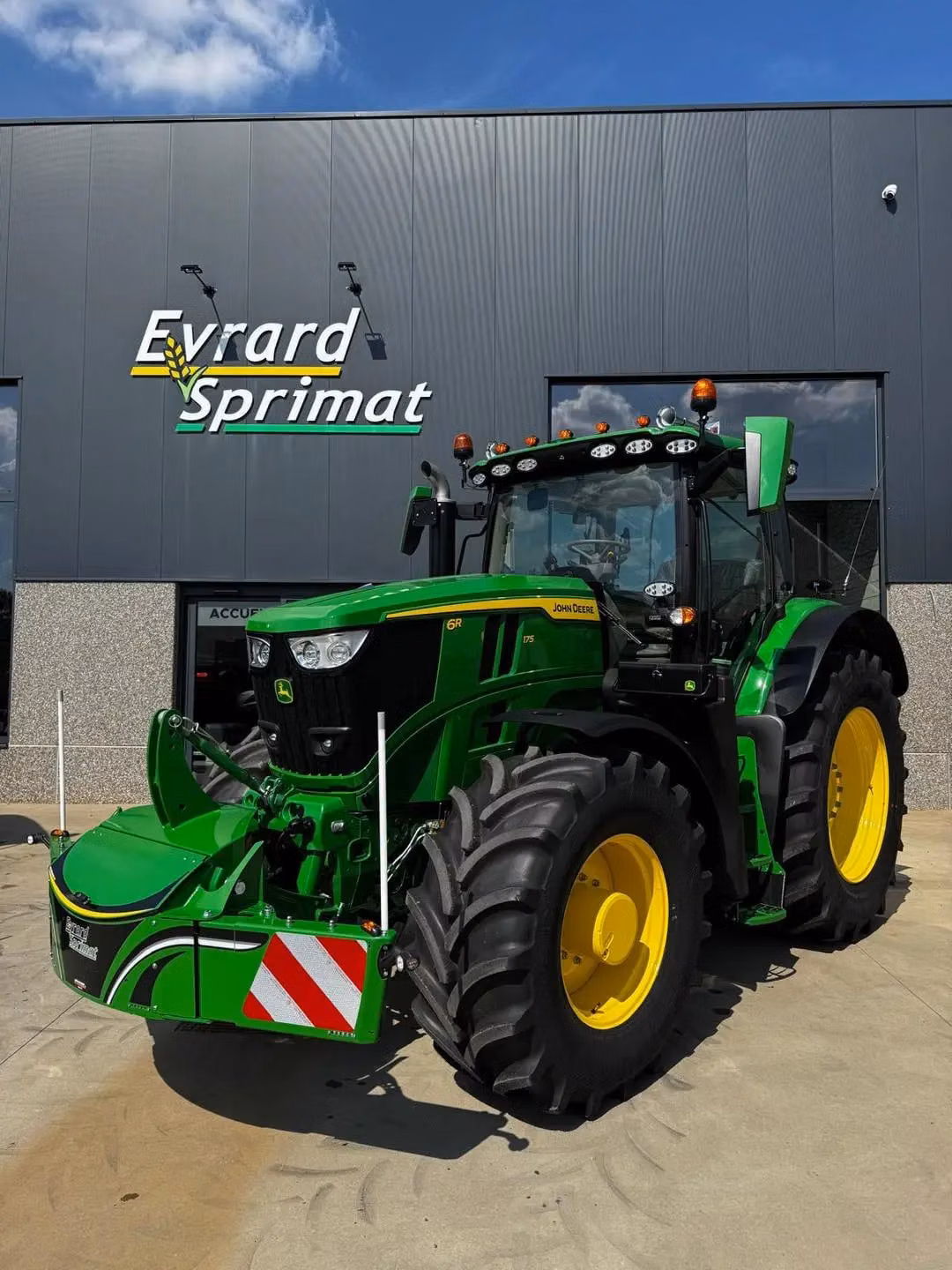 John Deere tractor with a TractorBumper front bumper and rear weight