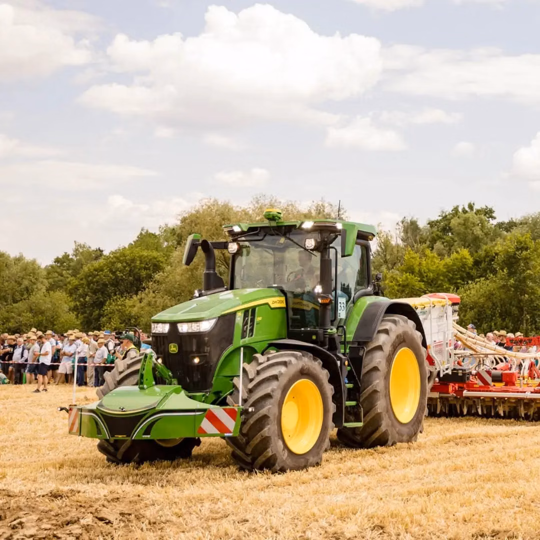 John Deere tractor with a TractorBumper front bumper and rear weight