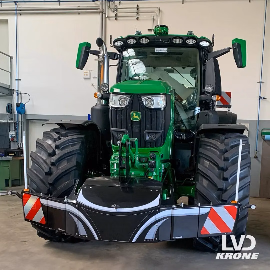 John Deere tractor with a TractorBumper front weight and LED lighting