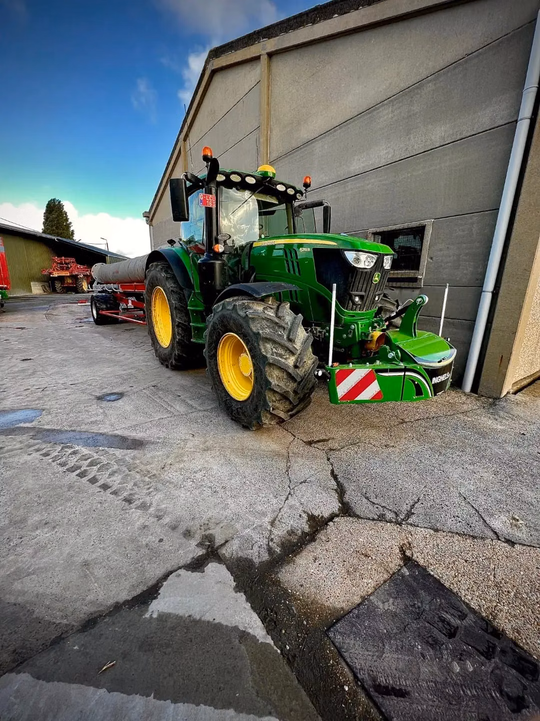 John Deere tractor with a TractorBumper front bumper and front weight