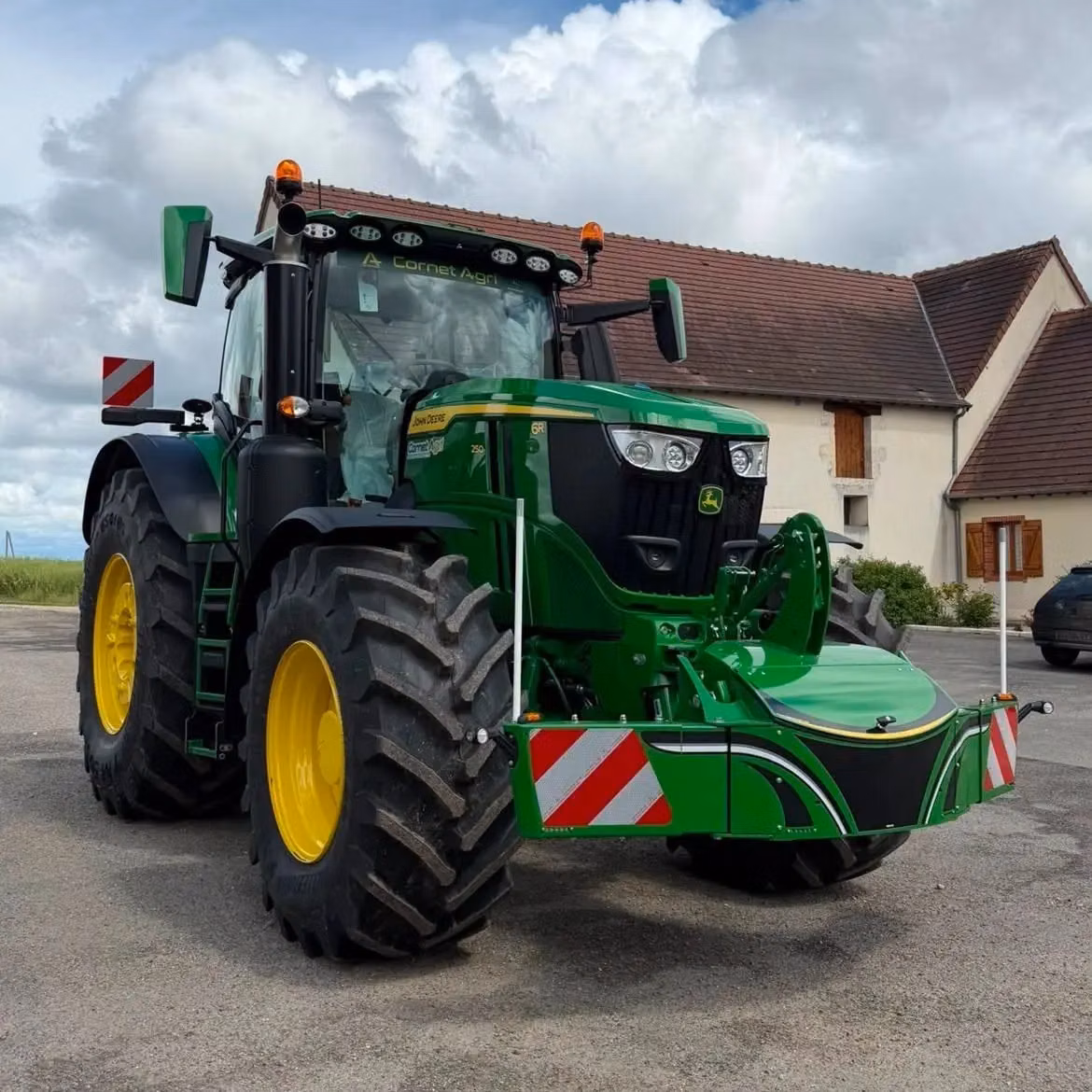John Deere tractor with a TractorBumper front box and marker boards