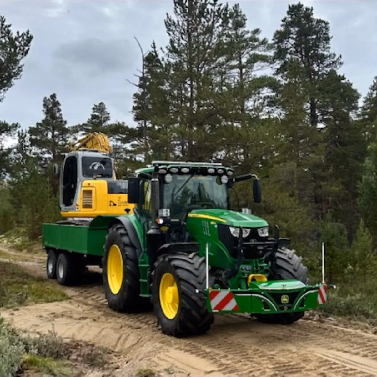 John Deere tractor with a TractorBumper front box and marker boards