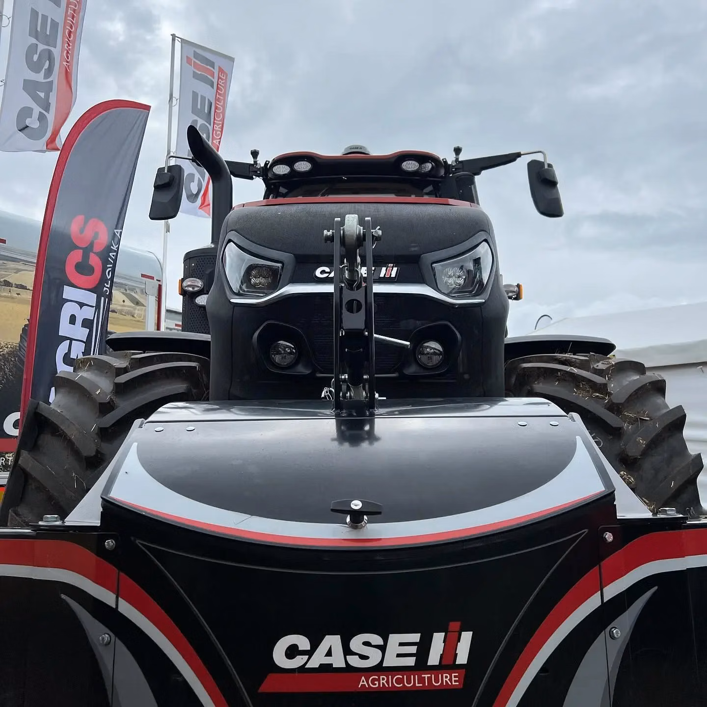 Front view of a Case IH tractor equipped with a black front weight bumper featuring the Case IH Agriculture logo