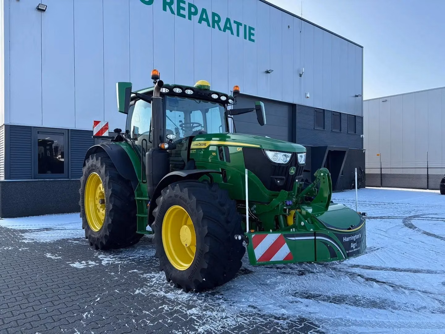 John Deere tractor with a TractorBumper front weight