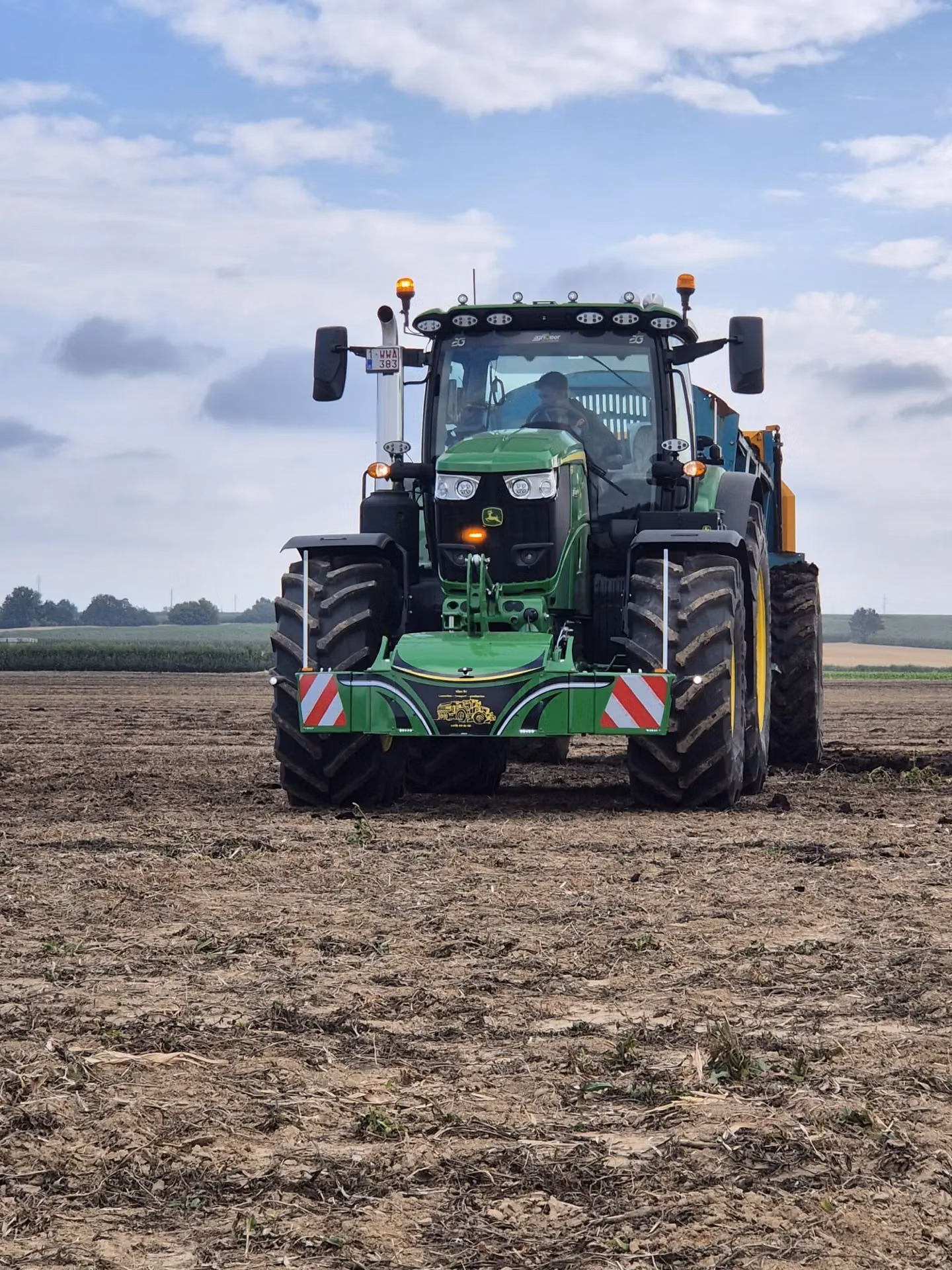 John Deere tractor with a TractorBumper front box and marker boards