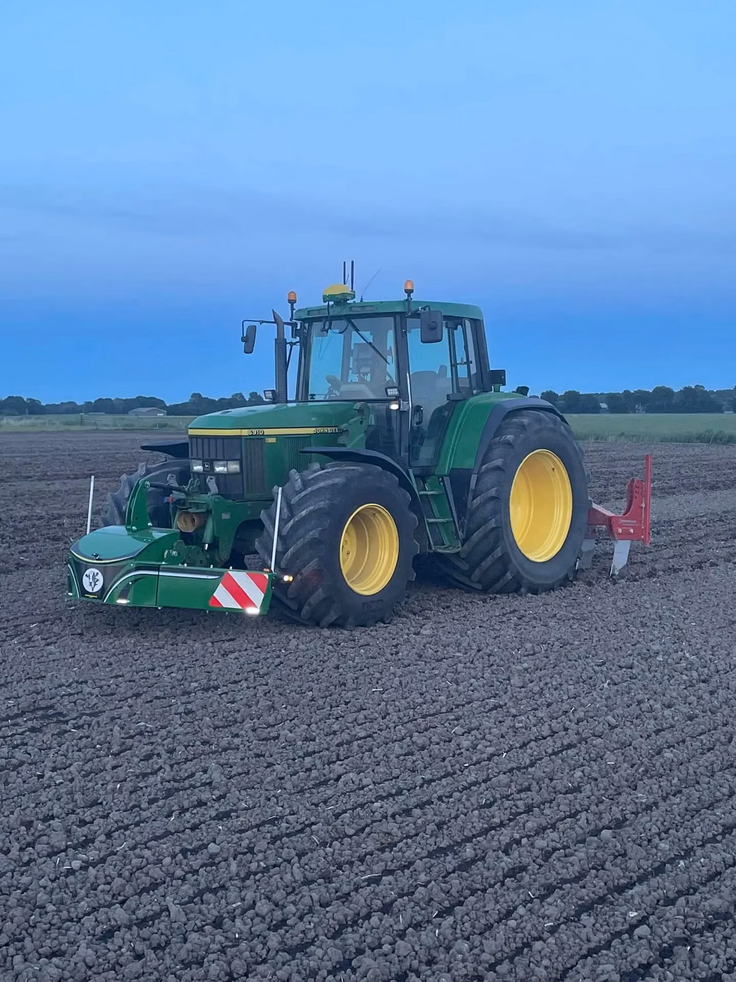 John Deere tractor with a TractorBumper front weight