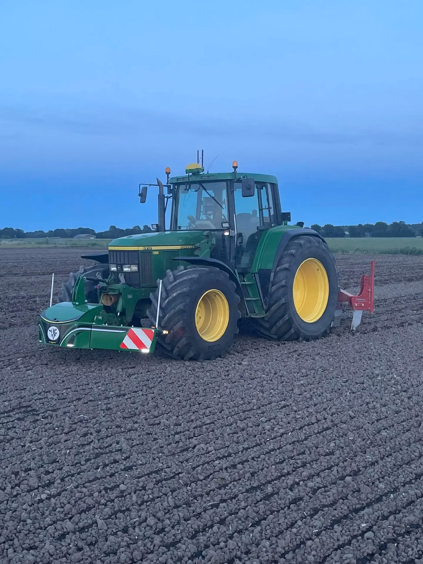 John Deere tractor with a TractorBumper front weight