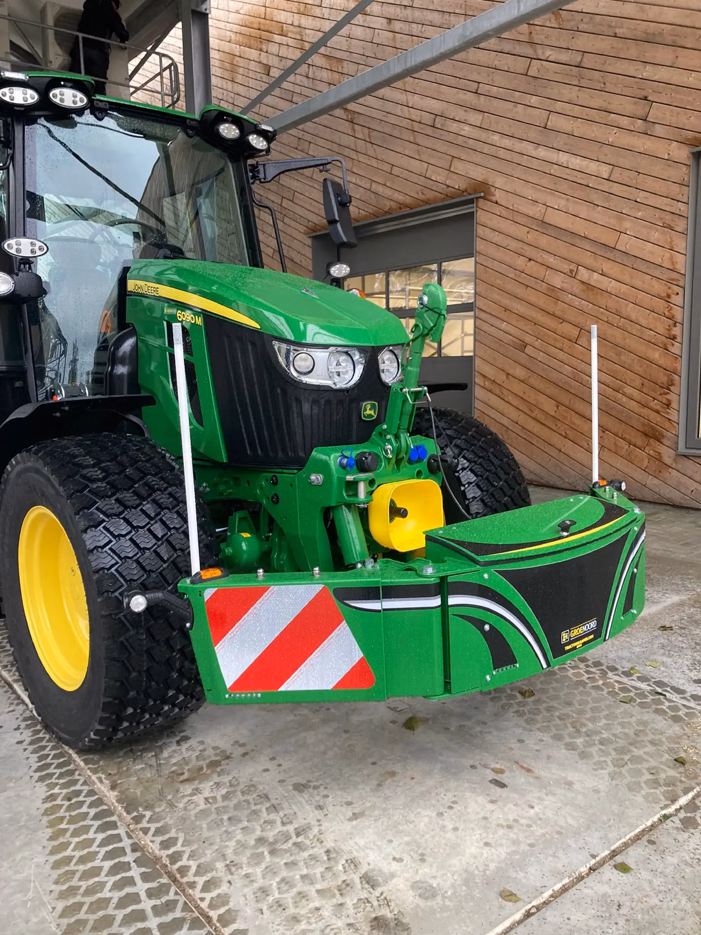 John Deere tractor with a TractorBumper front box and marker boards