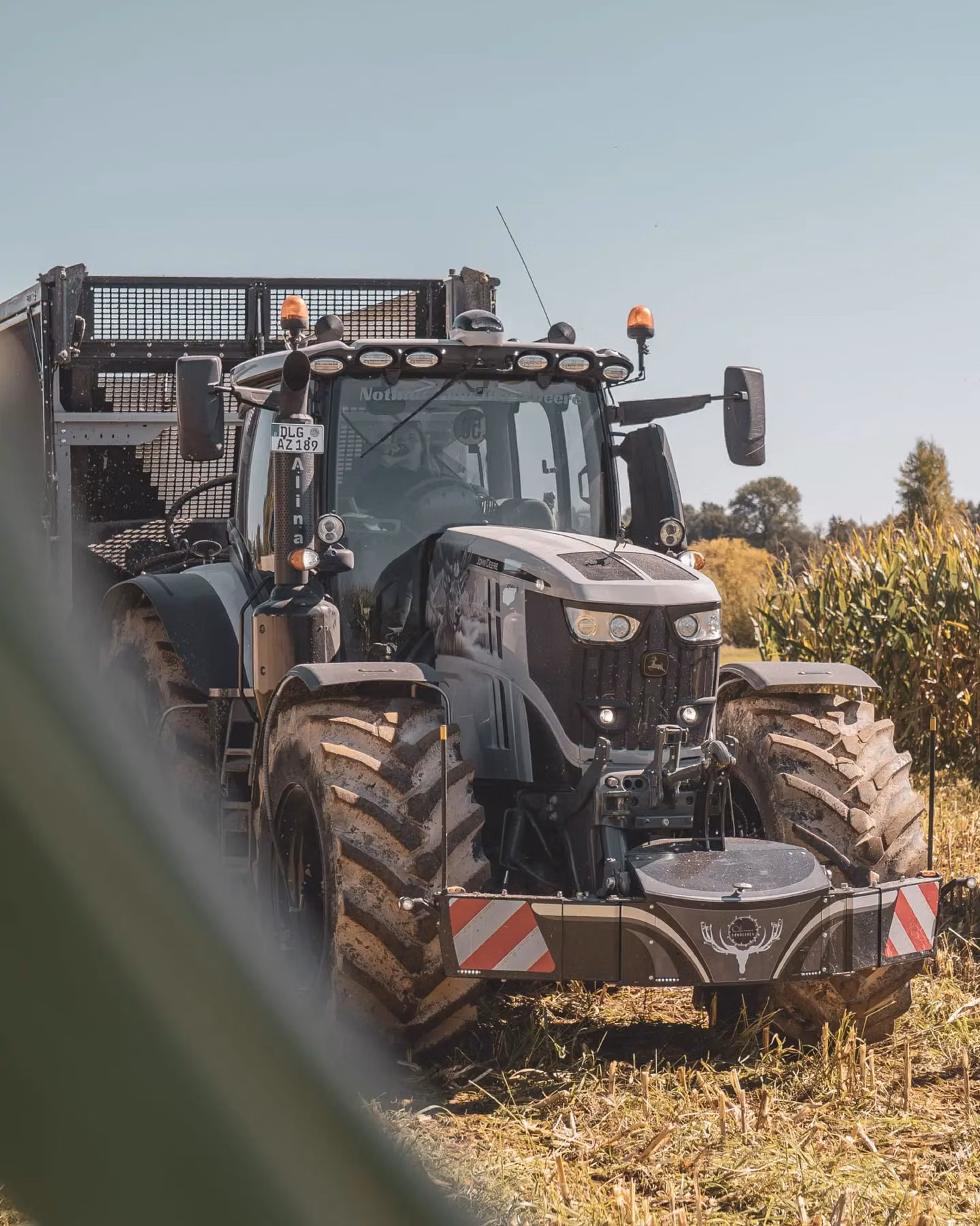 John Deere tractor with a TractorBumper front bumper and front weight