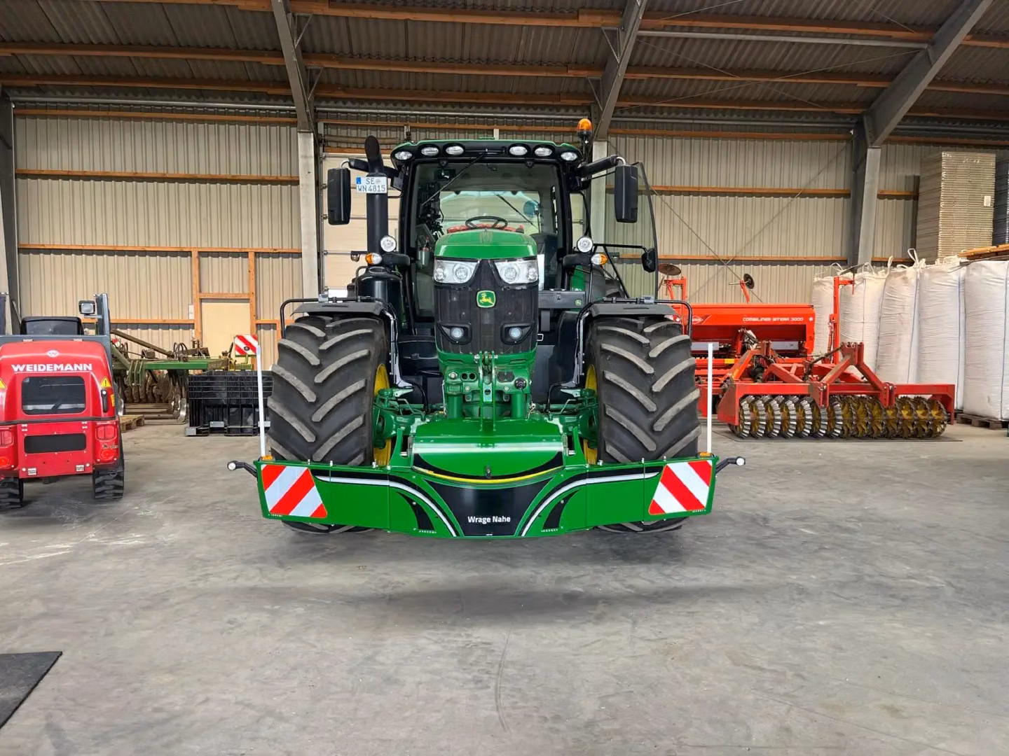 John Deere tractor with a TractorBumper front weight