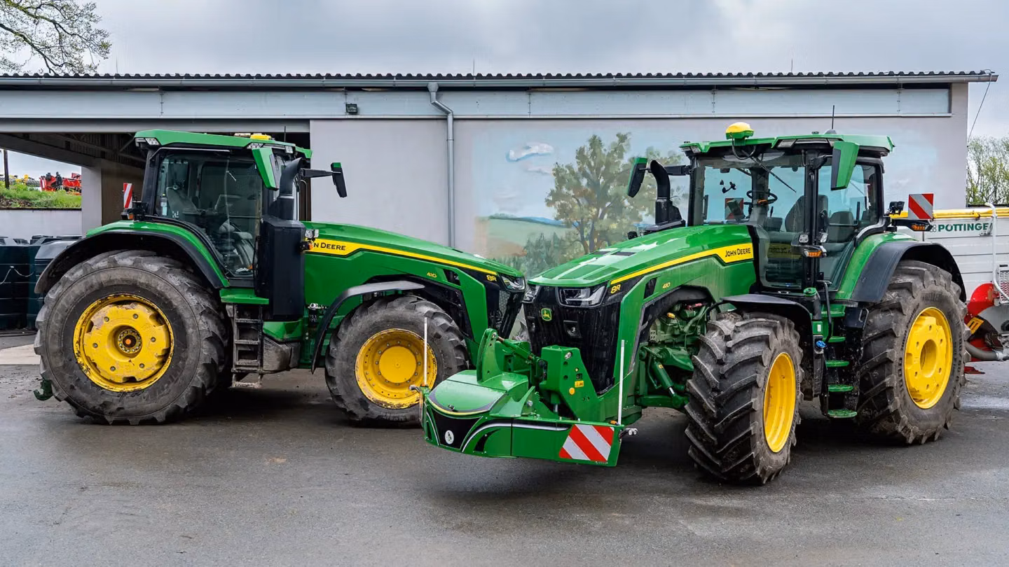 John Deere tractor with a TractorBumper front bumper and rear weight