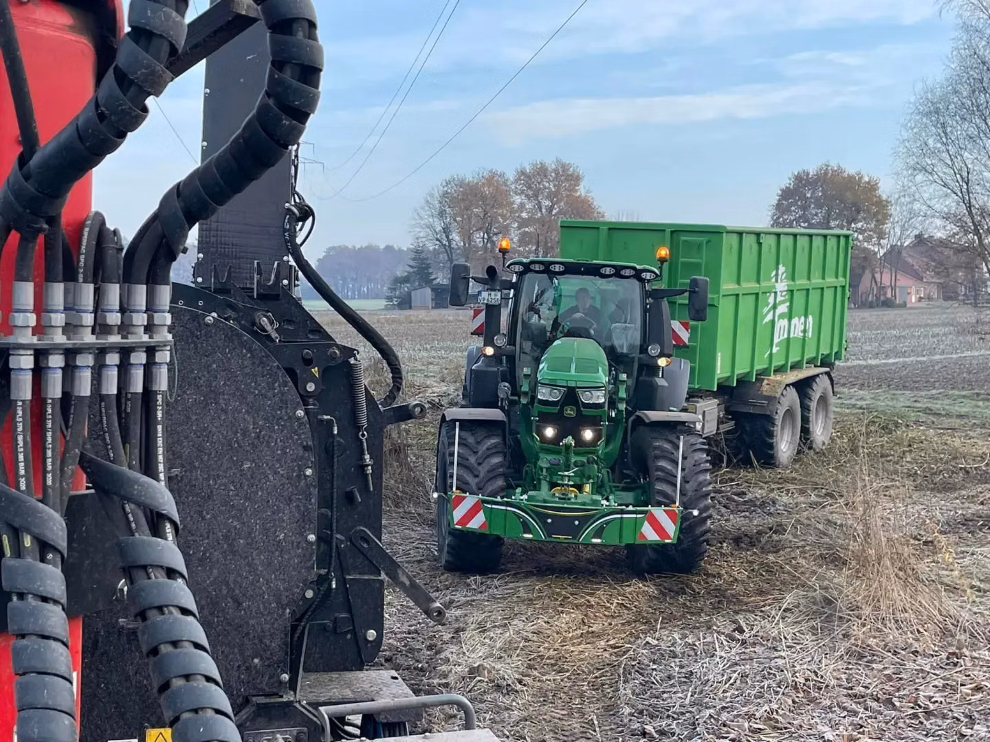 John Deere tractor with a TractorBumper front bumper and rear weight