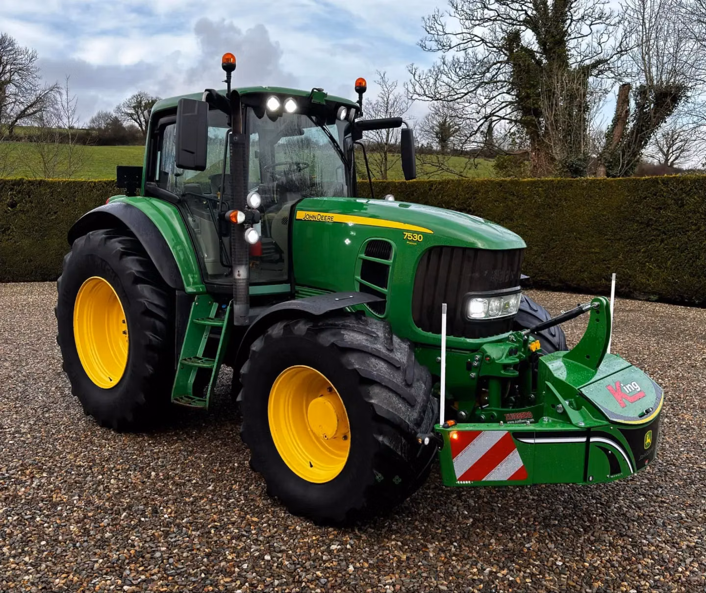 John Deere tractor with a TractorBumper front box and marker boards