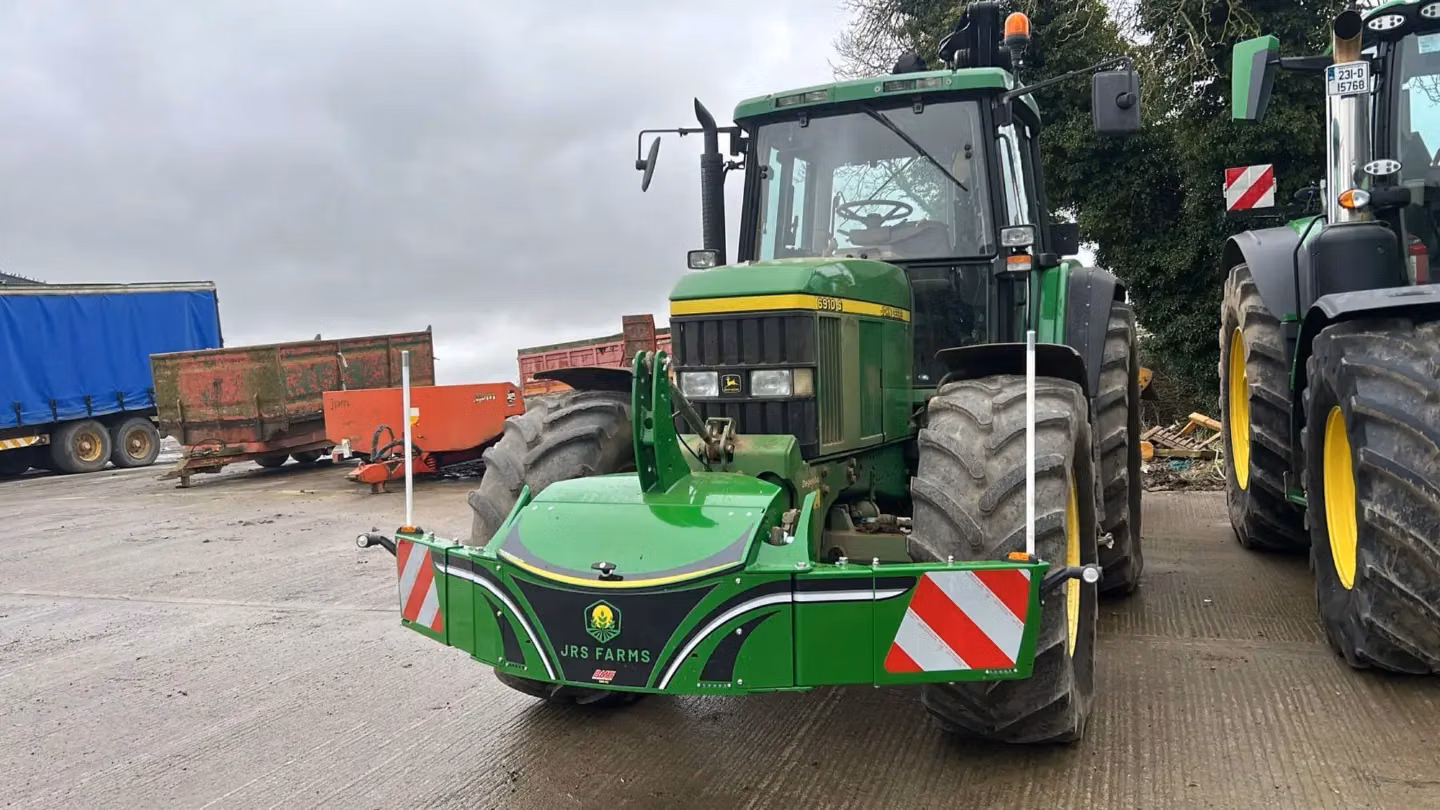 John Deere tractor with a TractorBumper front box and marker boards