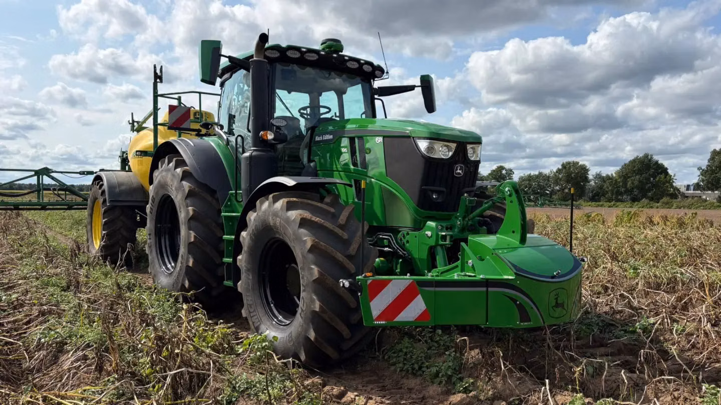 John Deere tractor with a TractorBumper front weight and LED lighting