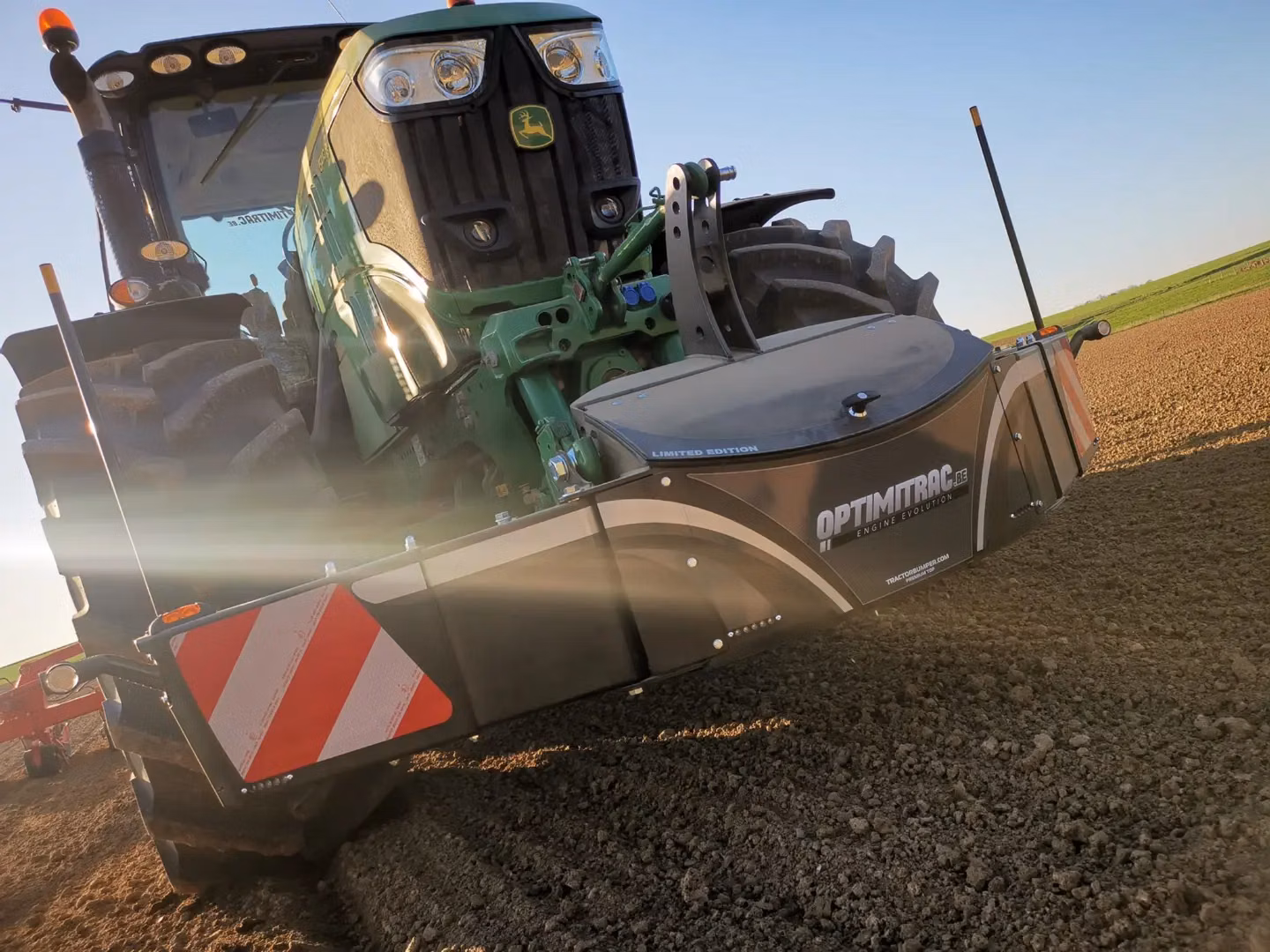 John Deere tractor with a TractorBumper front bumper and rear weight