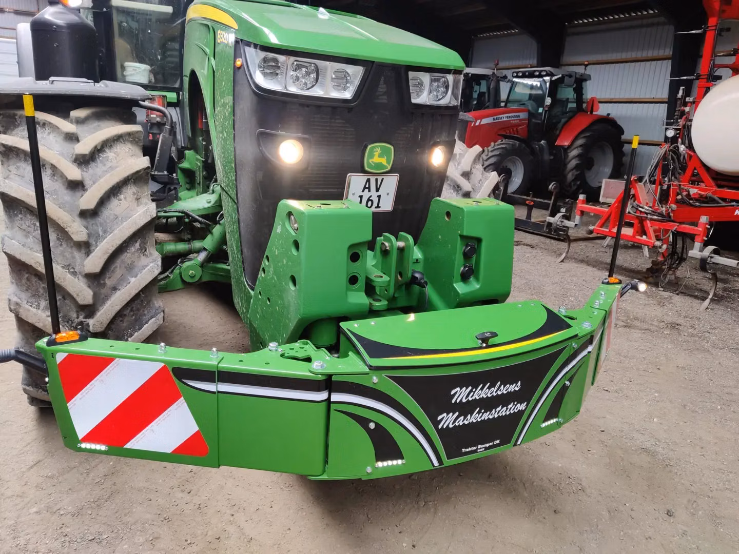 John Deere tractor with a TractorBumper front bumper and rear weight
