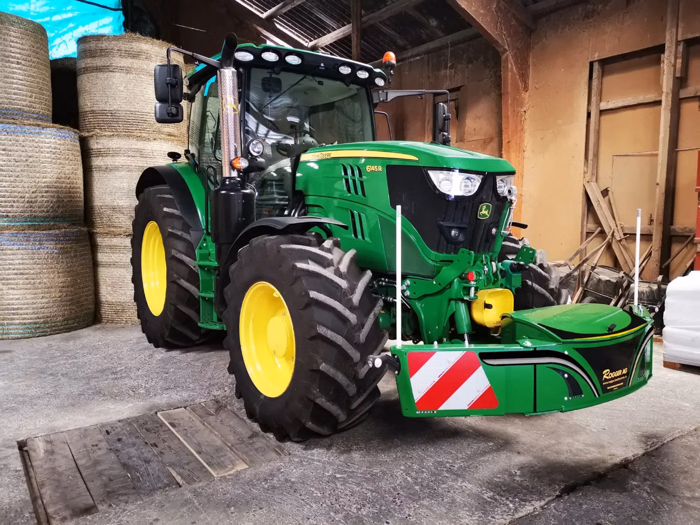 John Deere tractor with a TractorBumper front bumper and front weight