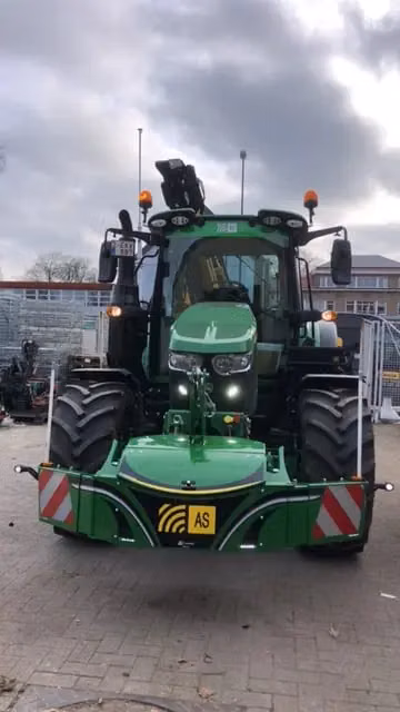 John Deere tractor with a TractorBumper front bumper and front weight