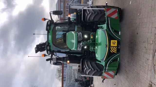 John Deere tractor with a TractorBumper front bumper and front weight
