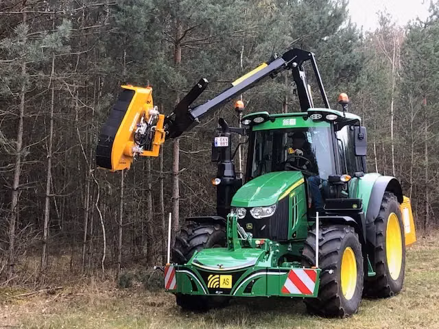 John Deere tractor with a TractorBumper front bumper and front weight