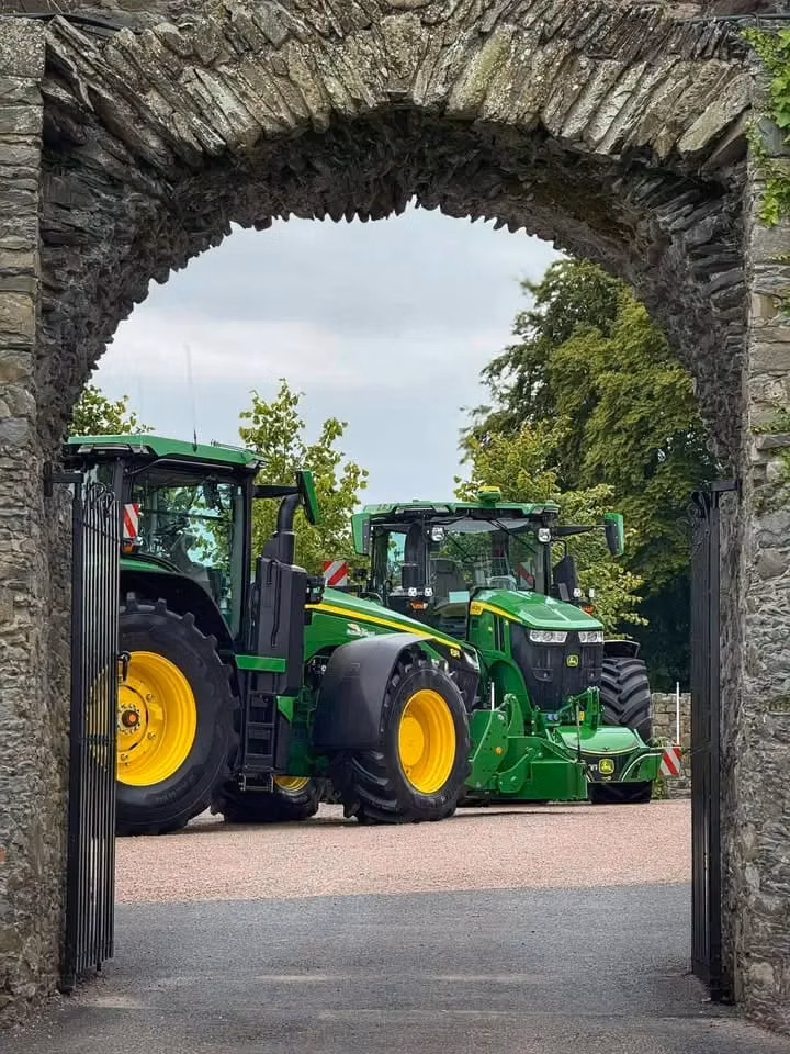 John Deere tractor with a TractorBumper front bumper and rear weight