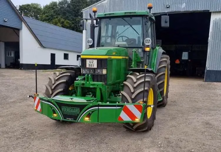 John Deere tractor with a TractorBumper front weight