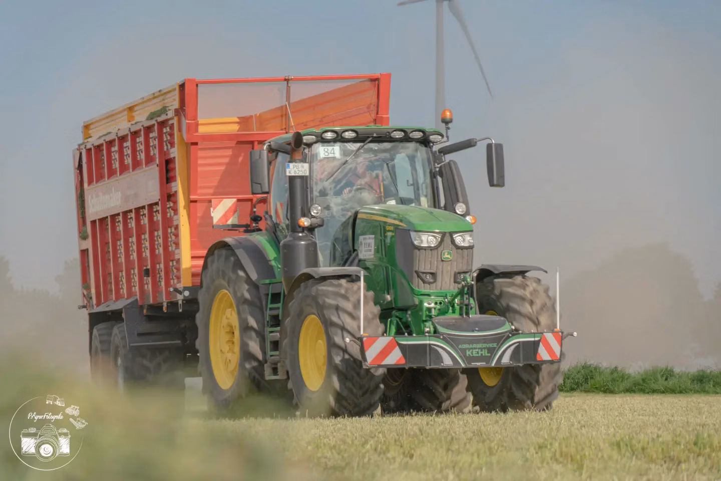 John Deere tractor with a TractorBumper front weight and LED lighting