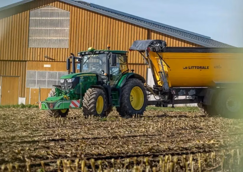 John Deere tractor with a TractorBumper front weight and LED lighting