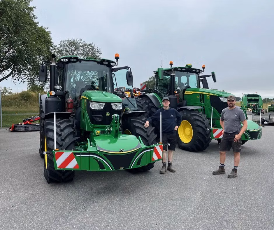 John Deere tractor with a TractorBumper front bumper and rear weight