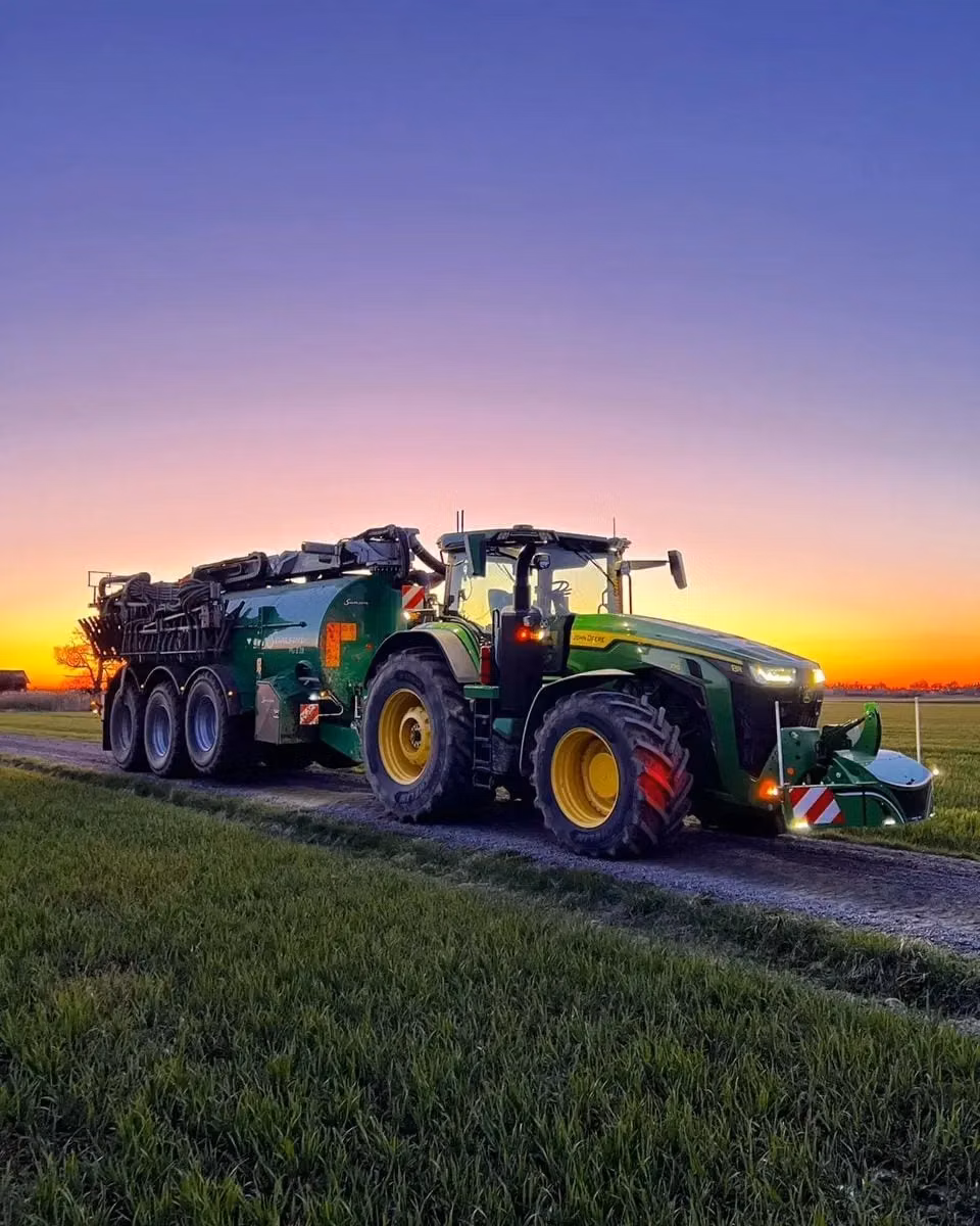 John Deere tractor with a TractorBumper front bumper and rear weight