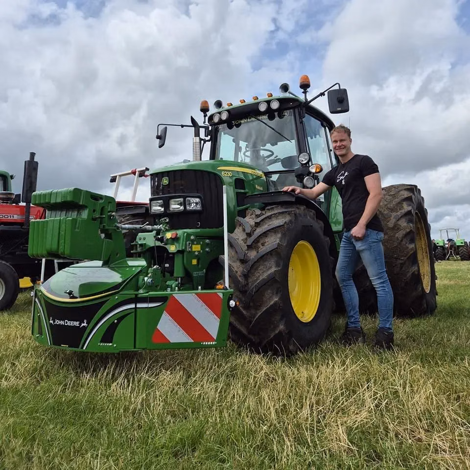 John Deere tractor with a TractorBumper front bumper and front weight